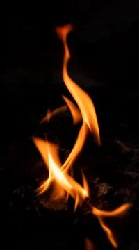 Vertical Fire pattern against black background photograph. Stock Photos