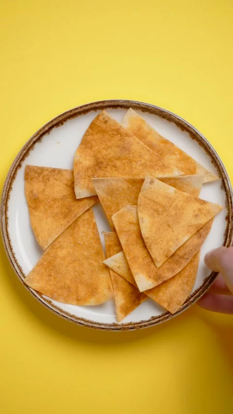 Vertical flat lay: chef puts plate with nachos to the colorful background Stock Footage 178894799