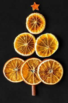 Vertical flat lay composition with dry orange slices, cinnamon stick and anise Foto stock