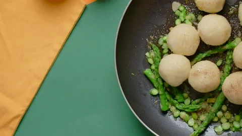 Vertical flat lay food video: the cook adds spices to the hot pan with fried Stock Footage 183882020