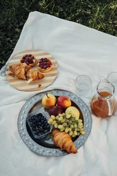 Vertical Flat Lay of Picnic Set, Fruits and Cakes with Croissants Laid Up on the Stock Photos