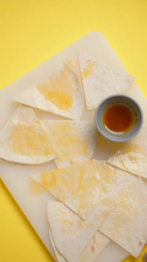 Vertical flat lay video: chef takes off the board with nachos and sauce Stock Footage 179404954