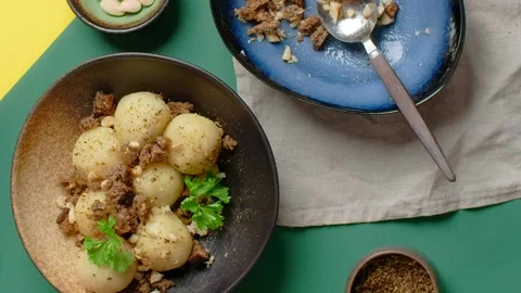 Vertical flat lay video: chef adds parsley to the potato gnocchi Stock Footage 181852190