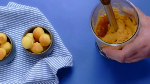 Vertical flat lay video: cooking of humus, chef blends nutt and carrot by Stock Footage 180578577