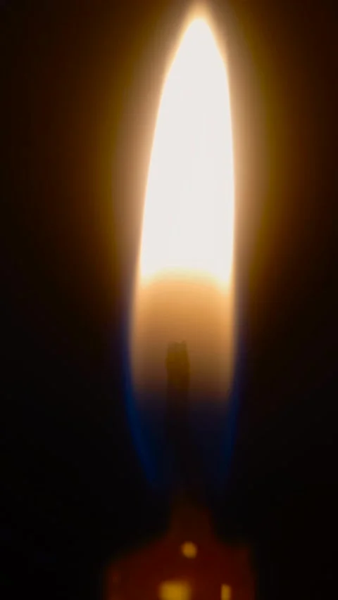 Vertical flickering candle flame macro shot Stock Footage 276881013