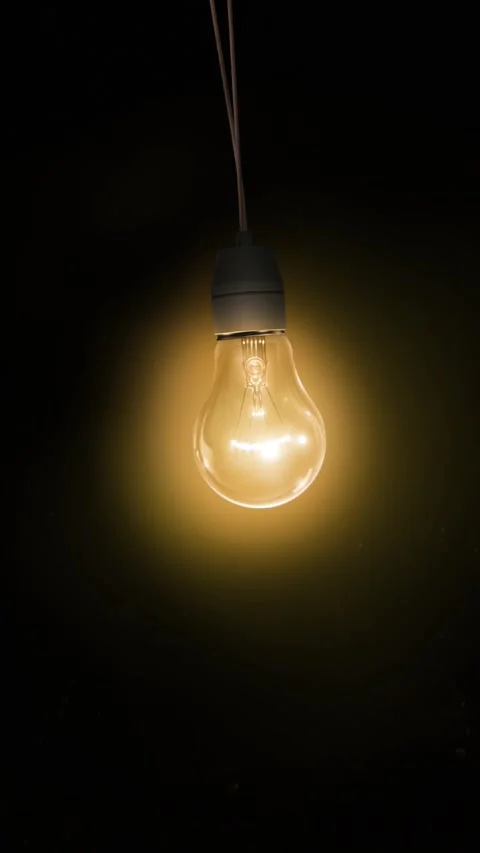 Vertical Flickering Yellow Light Bulb in the Dark 4K Loop Stock Footage 274450354