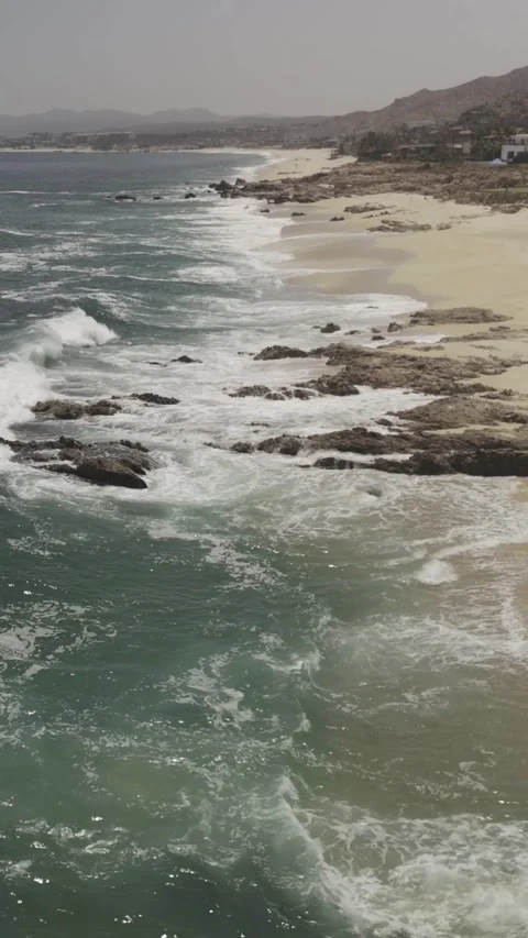 Vertical Flight over Waves &amp; Rocks Stock Footage 285565549