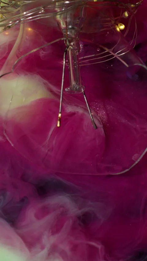 Vertical flow explode broken glass pink light bulb Stock Footage 315957667