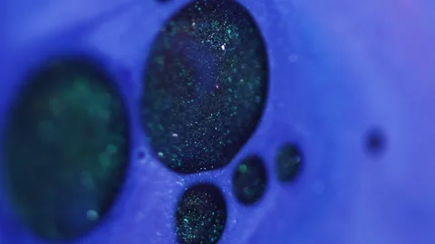 Vertical flowing droplets shiny fluid paint oil Stock Footage 335185164