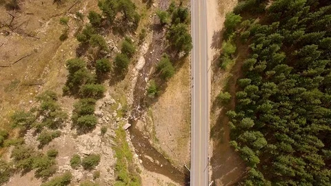 Vertical Fly Over Mountain Road Color Corrected Stock Footage 100210402