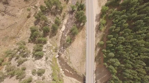 Vertical Fly Over Mountain Road Stock Footage 100210447