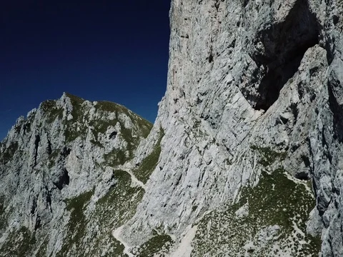 Vertical flying up mountain rock wall 2k Stock Footage 83957627