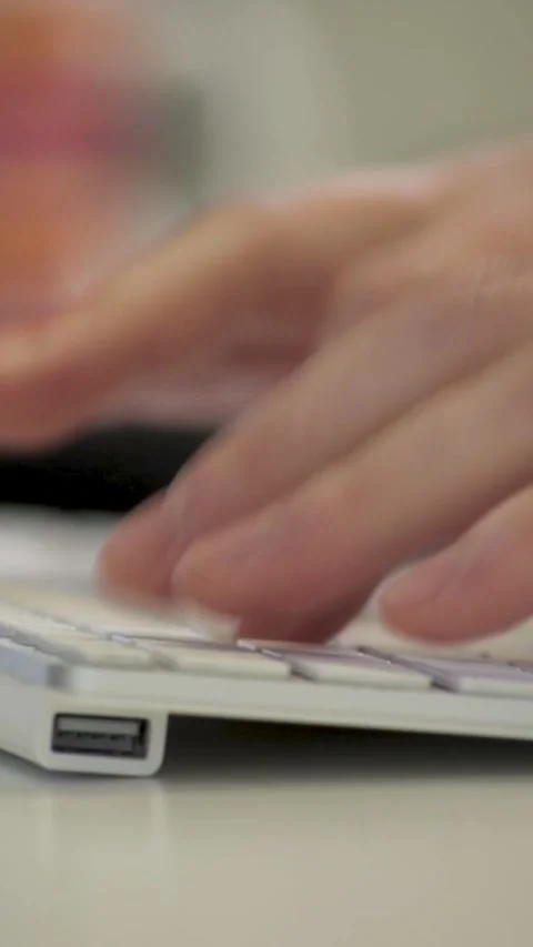 Vertical Focused Close-Up of Hands Typing on a Keyboard in a Professional Office Stock Footage 282666305