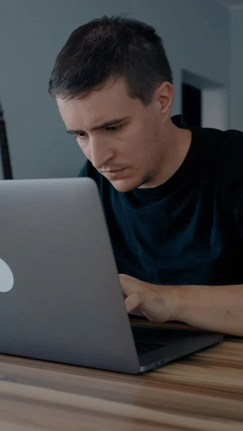 Vertical of Focused web designer develops website on modern laptop Stock Footage 274152538