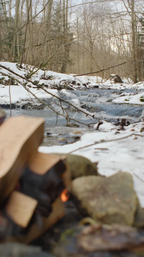 Vertical footage of beautiful mountains river and bonfire at winter time Stock Footage 297963301