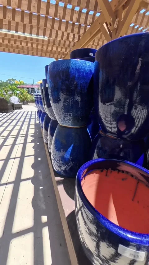 Vertical Footage of Blue Ceramic Pots at Garden Nursery Stock Footage 312884081
