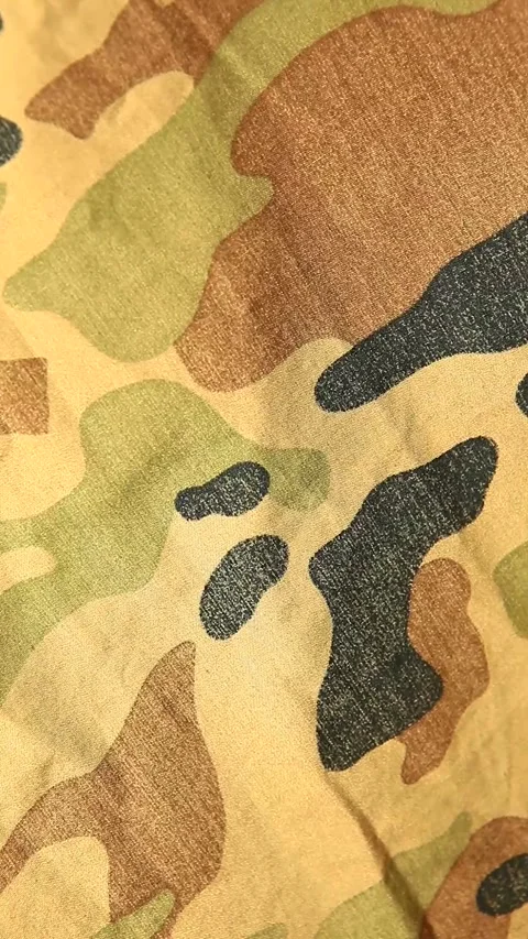 Vertical footage of camouflage background Stock Footage 297747796