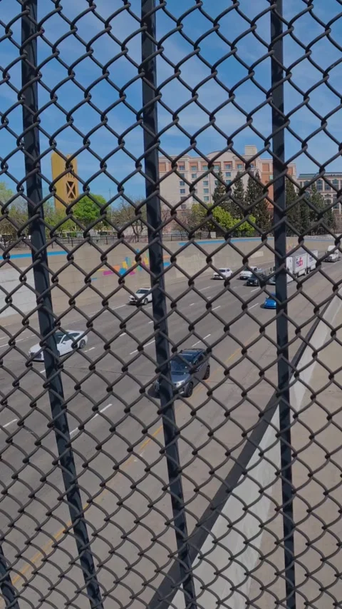 The vertical footage captures vehicles moving along the multi-lane I-5 Video stock 331223751