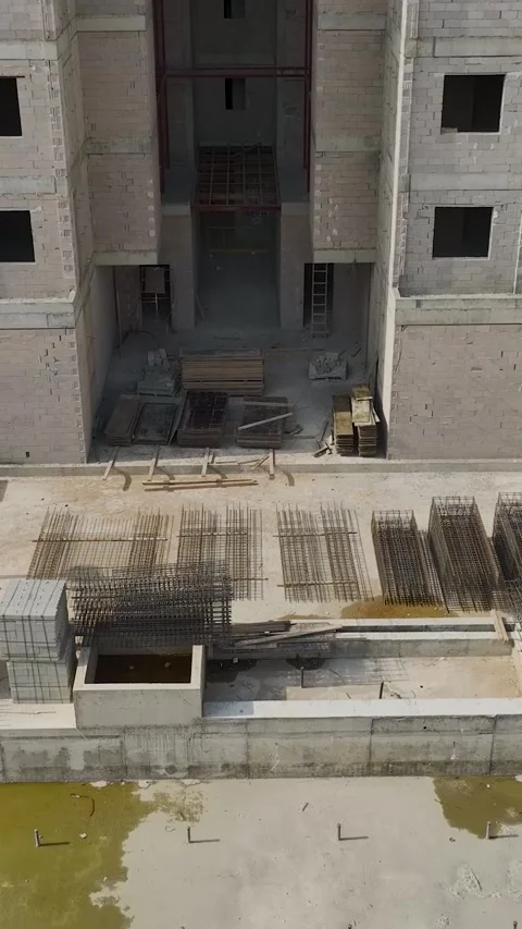 Vertical Footage Construction Workers and Materials from Top Down Perspective Stock Footage 341733069