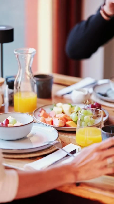 Vertical footage of a couple at a breakfast table Stock Footage 340118345