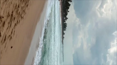 Vertical footage. Dominican beach Macao. Tropical beach blue with sky, clouds. Vidéo 243376053