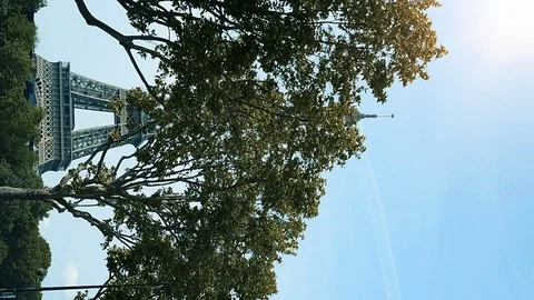 Vertical footage Eiffel Tower in Paris, France sunlight flare cinematic Stock Footage 107878119