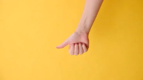 Vertical footage of female making thumb up gesture, demonstrates approval Stock Footage 252829481