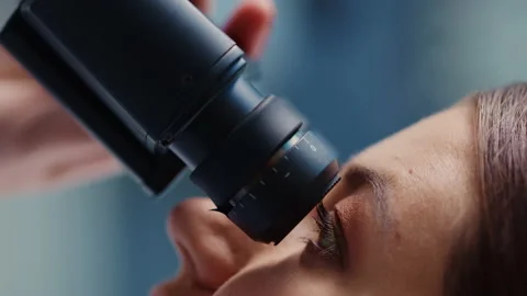 Vertical Footage Female Scientist Using Microscope in Laboratory Stock Footage 146913694
