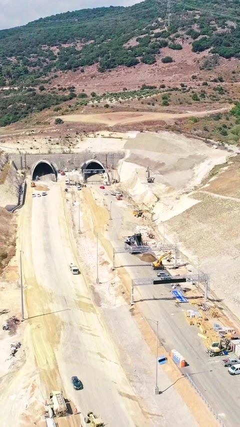 Vertical footage of large highway construction project with tunnels and bridges Stock Footage 319893287