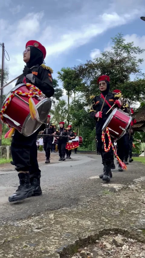 Vertical footage of a marching band performing in a street parade Stock Footage 343658480