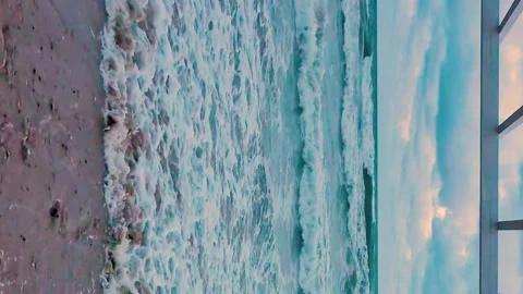Vertical Footage, Ocean Foaming Waves Falling On Shore Sandy Beach Beautiful Dar Stock Footage 320941878
