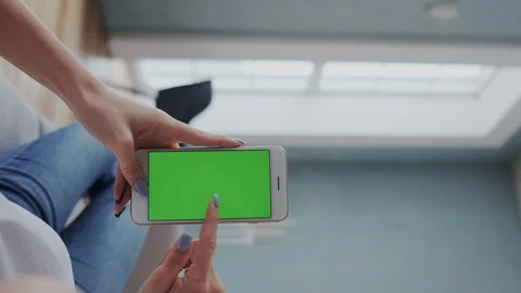 Vertical footage. Point of view. Mock-up Tracking or Green screen in Girl Hands Stock Footage 122417644