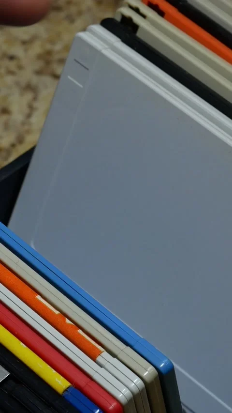 Vertical footage searching through floppy disk Stock Footage 235660262
