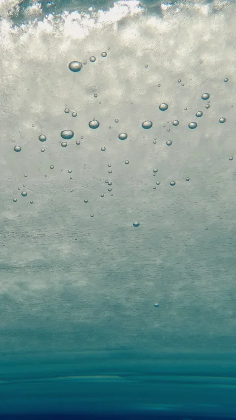 Vertical footage, solid layer of ice is covered with frozen air bubbles in it Stock Footage 330594544