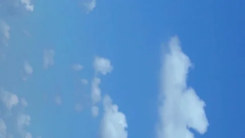 Vertical Footage. Time Lapse of Light Fluffy Clouds in a Clear Blue Sky in Perfe Stock Footage 218121966