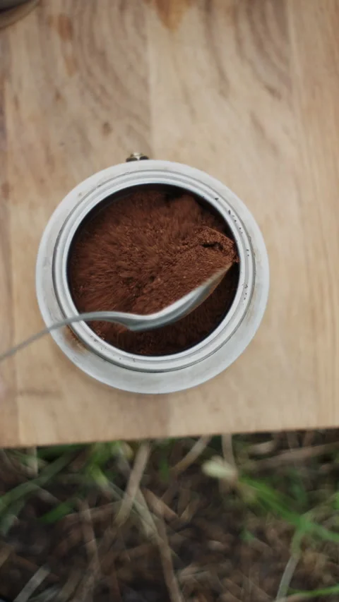 Vertical footage of unknown man prepare coffee and breakfast outdoors Stock Footage 285709981