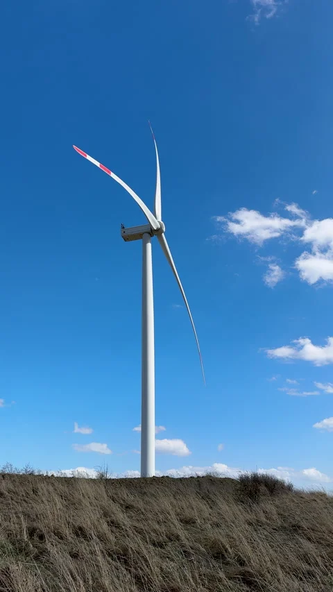 Vertical footage of wind power generation with turbine on sunny day Stock Footage 306793063