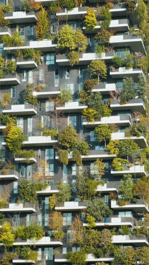 Vertical forest building with lush greenery and trees integrated into modern Stock-Footage 295689667