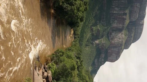 Vertical format Blyde River flows muddy with flood water, South Africa Stock Footage 328623218