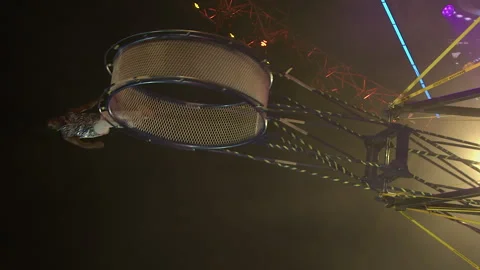 Vertical format circus act: Acrobats perform Wheel of Death on stage Stock Footage 339864301