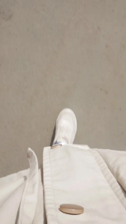 Vertical format. Human legs walk down the street, first person view from above. Stock Footage 271616779