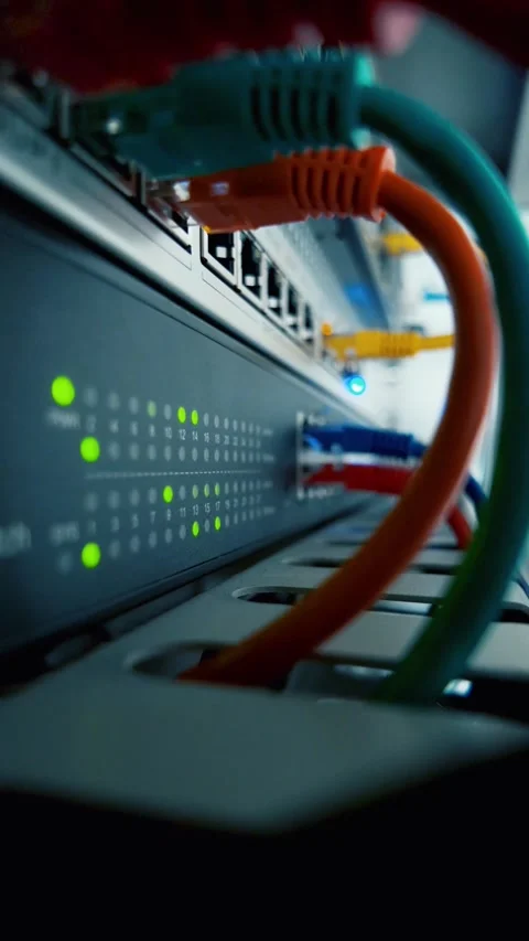 Vertical format macro video of colorful network cables and blinking LEDs, p.. Stock Footage 321138709