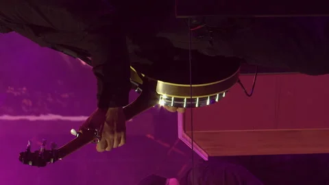 Vertical format: Musician plays banjo on stage at country music concert Stock Footage 339853851