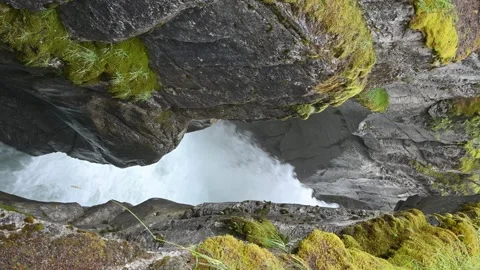 Vertical format raging mountain river through a rocky canyon with moss Stock Footage 306479629