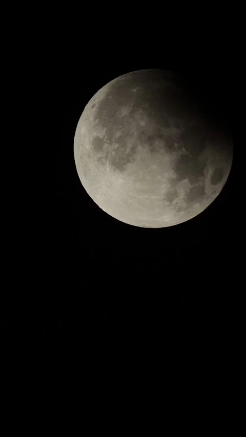 Vertical format time lapse video of the partial lunar eclipse in September 2024 Stock Footage 285241127