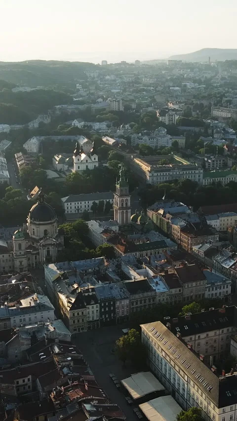 Vertical format Video of Aerial roofs and streets Old City Lviv, Ukraine Stock Footage 303163440