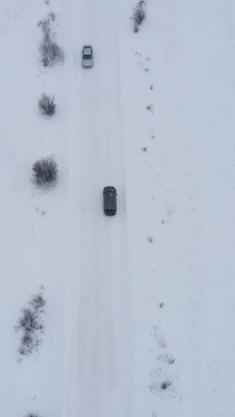 Vertical Format Video of Car Driving the Through Snow and Blizzard. Falling Snow Stock Footage 304808348