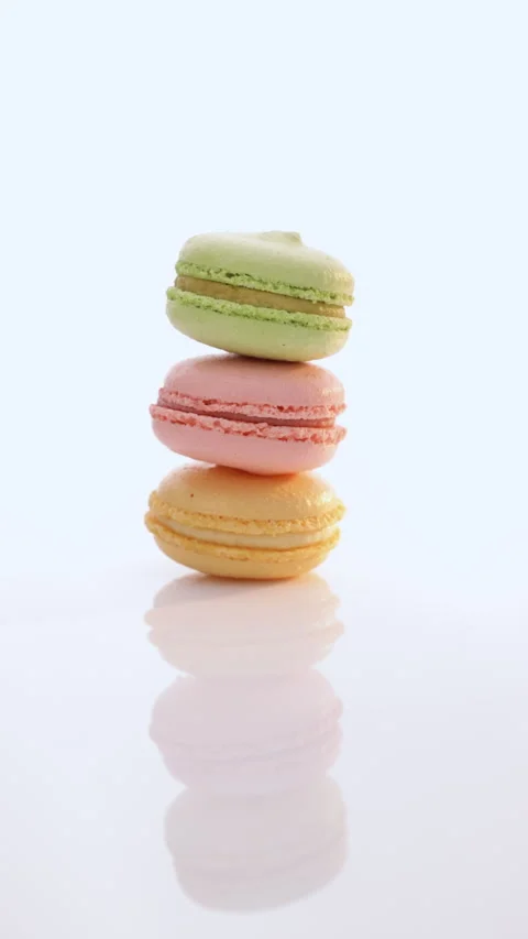 Vertical Format Video of colorful cake macaroons on a light background. Macarons Stock Footage 305696274