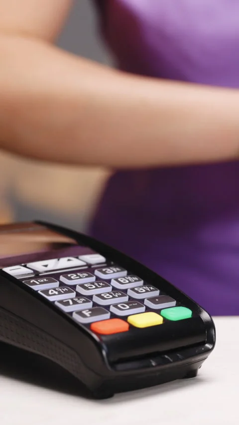 Vertical Format Video of Customer paying with NFC technology by smart watch Stock Footage 304901223