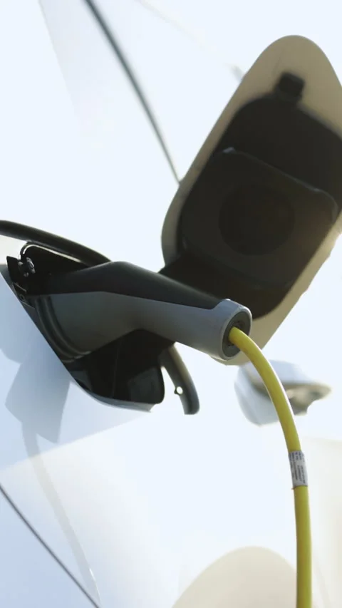 Vertical Format Video of Electric car charging. Electric vehicle charging port Stock Footage 306119222